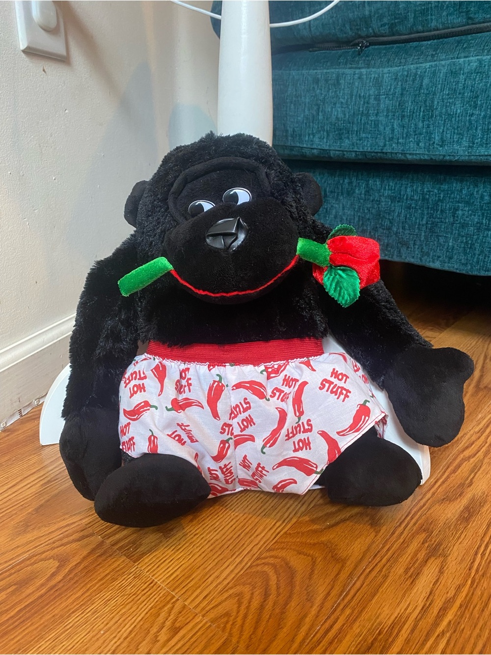Plush Black Gorilla with Red Rose and Patterned Shorts
